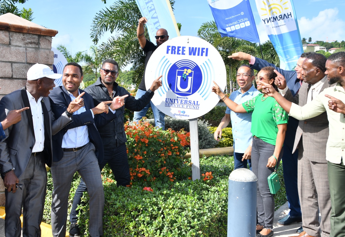 Deputy Prime Minister and Minister of National Security, Hon. Dr. Horace Chang (fifth right), is joined by (from left) Chief Executive Officer, Universal Service Fund, Daniel Dawes; General Manager of the Urban Development Corporation (UDC), L. Robert Honeyghan; St. James Central Member of Parliament, Heroy Clarke; Councillor for the Spring Garden Division, Dwight Crawford; Minister of Legal and Constitutional Affairs, Hon. Marlene Malahoo Forte; Minister of State in the Office of the Prime Minister (West), Hon. Homer Davis; Mayor of Montego Bay and Chairman of the St. James Municipal Corporation, Councillor Leeroy Williams; and Deputy Mayor of Montego Bay, Councillor Richard Vernon, at the launch of the free public Wi-Fi access at Harmony Beach Park in Montego Bay, St. James, on Friday, December 15.