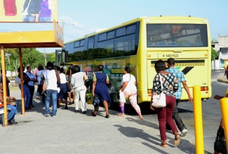 Commuters boarding a JUTC bus that plies the Spanish Town to Half-Way Tree route.

