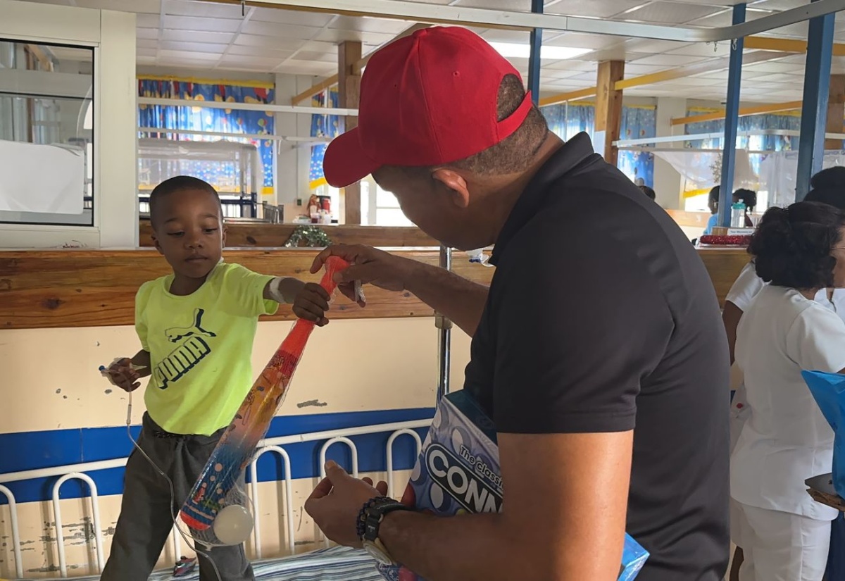 Health Minister Brings Christmas Cheer to Young Patients