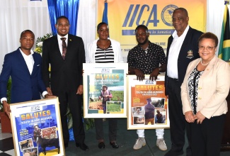 Minister of Agriculture, Fisheries and Mining, Hon. Floyd Green (second left); State Minister, Hon. Franklin Witter (second right); and Inter-American Institute for Cooperation on Agriculture (IICA) Representative in Jamaica, Dr. Elizabeth Johnson (right), share a moment with outstanding agricultural entrepreneurs who were recognised by the IICA, during a ceremony held on Wednesday (December 6), at the Terra Nova All-Suite Hotel in Kingston. They are (from left) first-place awardee, Kacheif Brown; second-place awardee, Ieasha Johnson; and third-place awardee, Junior Senior.

 