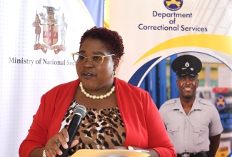 Chief Technical Director at the Ministry of National Security, Shauna Trowers, delivers the keynote address on behalf of the Minister of State, Hon. Juliet Cuthbert-Flynn, at a graduation ceremony held at the South Camp Adult Correctional Centre in St. Andrew today (November 30).