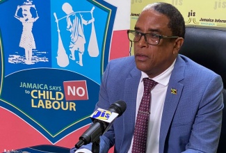 Minister of State in the Ministry of Labour and Social Security, Dr. the Hon. Norman Dunn.

