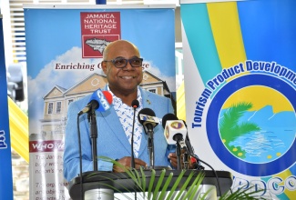 Minister of Tourism, Hon. Edmund Bartlett, addresses a ceremony to officially open the renovated Seville Heritage Park in St. Ann on December 8.