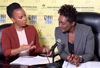 Principal Director of the Public Sector Modernisation Division (PSMD), Office of the Cabinet, Karlene McKenzie Spencer (right) and Senior Director, PSMD, Danielle Jones Cox, are in discussion at a recent Think Tank held at the Jamaica Information Service  (JIS) head office in Kingston.
