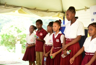 Students of the Ginger Ridge Primary and Infant School in St. Catherine perform at the recent commissioning of the multimillion-dollar Connors/Ginger Ridge Water Scheme at a ceremony held at the school.