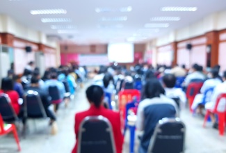 Blurred picture of conference of parents and teachers. 