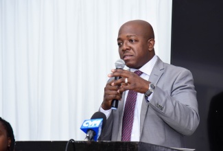 Minister of Labour and Social Security, Hon. Pearnel Charles Jr., addresses a Labour Advisory Council Sub-Committee Focus Group workshop on ‘Fixed Term Contracts’, at the Spanish Court Hotel in New Kingston on January 16.