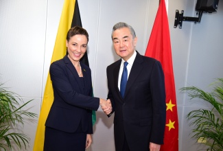 Minister of Foreign Affairs and Foreign Trade, Senator the Hon. Kamina Johnson Smith, shakes hands with Minister of Foreign Affairs of the People’s Republic of China, His Excellency Wang Yi, shortly after his arrival at the Ministry’s offices in downtown Kingston on Saturday (Jan.19) for a meeting.
