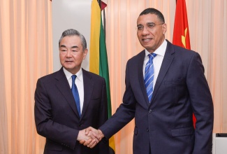 Prime Minister, the Most Hon. Andrew Holness (right), shakes hands with Minister of Foreign Affairs of the People’s Republic of China, His Excellency Wang Yi, shortly before a meeting at the Office of the Prime Minister on Saturday (Jan. 20), which involved several Cabinet Ministers and members of the Chinese delegation. Minister Wang, who arrived in the island on Friday night (Jan. 19), is on a three-day visit aimed at strengthening the bilateral relationship between the countries. He departs the island on Sunday (Jan. 21).