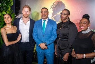 Prime Minister, the Most Hon. Andrew Holness (centre) and Mrs. Juliet Holness (second right), are joined by the Duke and Duchess of Sussex, Prince Harry (second left) and wife Meghan (left), and Minister of Culture, Gender, Entertainment and Sports, Hon. Olivia Grange (right), at the premiere of the Bob Marley movie ‘One Love’ at Carib 5 in Kingston on Tuesday (January 23).   


