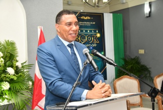 Prime Minister, the Most Hon. Andrew Holness, addresses Tourism Minister, Hon. Edmund Bartlett’s double book launch, on January 10, at Devon House in Kingston. The books are titled ‘The Journey, the Service, the Man Edmund Bartlett’s Time Capsule – 1980 -2022’, and ‘Thought Leadership on Tourism Resilience and Sustainability in the 21st Century’.

