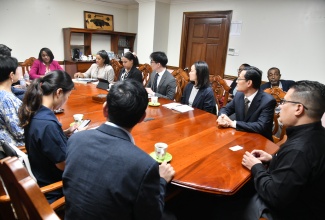 Minister without Portfolio in the Ministry of Economic Growth and Job Creation, Senator the Hon. Matthew Samuda (right) chairs a meeting with a delegation from the Korea International Co-operation Agency (KOICA) held at the Ministry’s New Kingston offices on January 18.