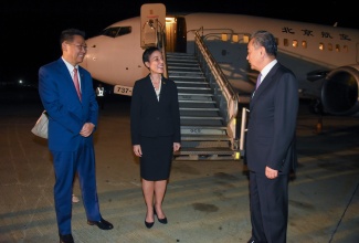 Minister of Foreign Affairs and Foreign Trade, Senator the Hon. Kamina Johnson Smith, converses with Minister of Foreign Affairs of the People’s Republic of China, His Excellency Wang Yi (right), shortly after the Foreign Minister’s arrival at the Norman Manley International Airport in Kingston on Friday (Jan. 19) for a three-day visit. Chinese Ambassador to Jamaica, His Excellency, Chen Daojiang, was also on hand to welcome Minister Wang.

