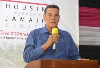 Minister of State in the Office of the Prime Minister (western Region), Hon. Homer Davis, brings greetings during a recent Housing Agency of Jamaica (HAJ) title ceremony, which was held at the Hillview Baptist Church in St. James.