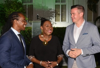 Minister of Culture, Gender, Entertainment and Sport, Hon. Olivia Grange, converses with World Anti-Doping Agency (WADA) President, Witold Bańka (right), during the third annual WADA Forum with Ministers of Sports in the Caribbean. The event was held on Tuesday (January 16) at Devon House in Kingston. At left is State Minister in the Ministry of Foreign Affairs and Foreign Trade, Hon. Alando Terrelonge. 