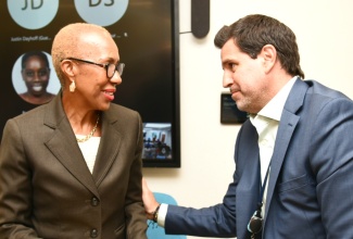 Minister of Education and Youth, Hon. Fayval Williams, converses with Chief of Operations, Inter-American Development Bank (IDB), Lorenzo Escondeur, during the IDB’s Financial Management Pilot School Sensitisation Forum on Thursday (January 18). The event was held at the IDB’s Country Office on Montrose Road in Kingston.

