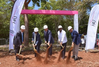 Prime Minister, the Most Hon. Andrew Holness (centre), and Tourism Minister, Hon. Edmund Bartlett (second right), broke ground for the Rhyne Park Estate housing development in St. James in 2019, providing 754 housing solutions for low and middle-income workers, including persons employed to the attractions and accommodations sector. Others (from left) are General Manager, Henan Fifth Construction Group, Baoguo Chen; then Minister without portfolio in the Ministry of Economic Growth and Job Creation, Hon. Pearnel Charles Jr.; and Chairman of the Housing Agency of Jamaica (HAJ), Norman Brown.