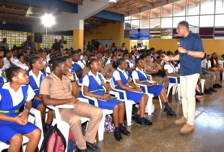 Prime Minister, the Most Hon. Andrew Holness, engages with students of Rusea