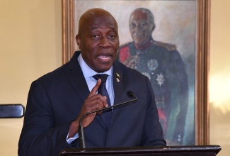 Chief Justice, Hon. Bryan Sykes, addresses Monday’s (January 8) swearing-in ceremony for the appointment of members of the judiciary to higher office, held at King’s House.