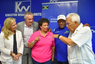 Minister of Industry, Investment and Commerce, Senator the Hon. Aubyn Hill (second right), shares in discussion with (from left) Head of the European Union (EU) Delegation to Jamaica, Ambassador Marianne Van Steen; Director with the EU, Felix Fernandez Shaw; President of the Shipping Association of Jamaica (SAJ), Corah Ann Sylvester; and Chairman of Jamaica Producers Group, Charles Johnson. Occasion was a press briefing held at the Kingston Wharves Limited Corporate Office on Friday (January 26)