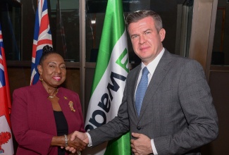 Minister of Culture, Gender, Entertainment and Sport Hon. Olivia Grange, greets World Anti-Doping Agency (WADA) President, Witold Banka, during the opening of WADA’s third Forum for Caribbean Sport Ministers on Tuesday (January 16) at the Jamaica Conference Centre in downtown Kingston. 