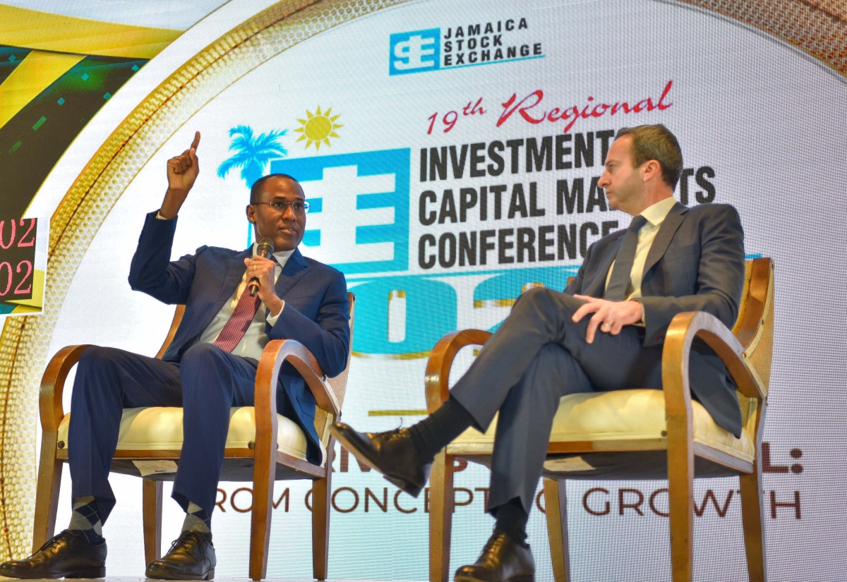 Minister of Finance and the Public Service, Dr. the Hon. Nigel Clarke (left), responds to a question at today’s (January 24) session of the Jamaica Stock Exchange (JSE) Investments and Capital Markets Conference at The Jamaica Pegasus hotel in New Kingston. At right is Head of Latin America Debt Capital Markets and Private Credit, Jefferies, Gabriel Roitman.
