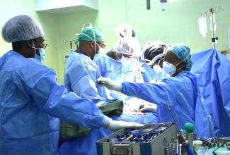 A medical mission team performs surgery at the Bustamante Hospital for Children.      

