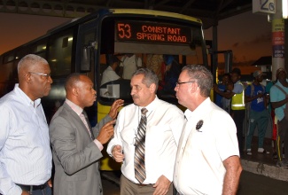 Minister of Science, Energy, Telecommunications and Transport and Mining Hon. Daryl Vaz (r) in discussion with (from left) Chairman of the Transport Authority (TA) Mr. Owen Ellington, TA Managing Director Mr. Ralston Smith, Managing Director of the Jamaica Urban Transit Company Mr. Paul Abrahams at the Half-Way-Tree Transport Centre on Monday January 9. Minister Vaz toured the Transport Centre to observe operations following the implementation of a temporary reduction in bus fares on January 1, 2023. 

