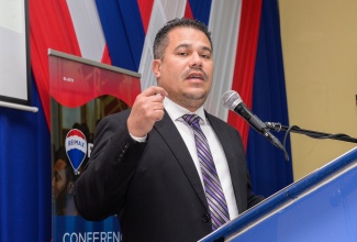 Minister without Portfolio in the Ministry of Economic Growth and Job Creation, Senator the Hon. Matthew Samuda, delivers the keynote address during the launch of the RE/MAX Jamaica Conference and Expo at the University of the Commonwealth Caribbean on Wednesday (January 17).