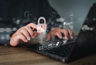 Man uses laptop with cyber internet security technologies and data encryption.