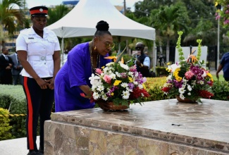 Minister of Culture, Gender, Entertainment and Sport, Hon. Olivia Grange, lays flowers at the shrine of National Hero and Jamaica’s first Prime Minister, the Right Excellent Sir Alexander Bustamante, on Saturday (February 24). The occasion was a floral tribute ceremony at National Heroes Park in Kingston marking the 140th anniversary of Sir Alexander’s birth.