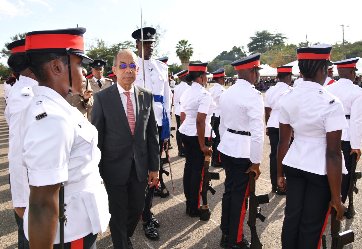 Minister of National Security, Hon. Dr. Horace Chang (centre), inspects police recruits at the passing out parade held at the National Police College of Jamaica, at Twickenham Park in St. Catherine, on January 31.