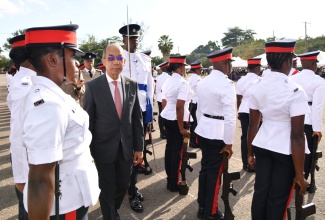 Minister of National Security, Hon. Dr. Horace Chang (centre), inspects police recruits at the passing out parade held at the National Police College of Jamaica, at Twickenham Park in St. Catherine, on January 31.

