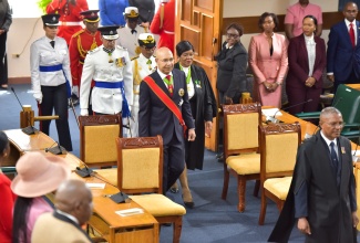 Governor-General, His Excellency the Most Hon. Sir Patrick Allen, enters Gordon House to deliver the Throne Speech to open the 2024/25 Parliament Year on Thursday (February 15). Immediately behind the Governor-General are (from left) Police Commissioner, Major General Antony Anderson; Chief of Defence Staff, Rear Admiral Antonette Wemyss-Gorman and Clerk to the Houses of Parliament, Valrie Curtis. In front is Marshal to the Houses, Captain Wayne Blake.

