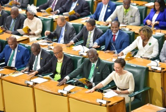 Government Members of Parliament and Senators applaud as the Governor-General, His Excellency the Most Hon. Sir Patrick Allen, delivers the Throne Speech to open the 2024/25 Parliamentary Year at Gordon House on Thursday (February 15).