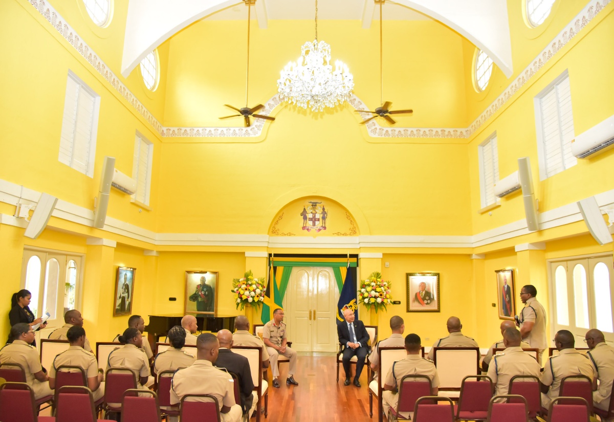 Governor-General, His Excellency the Most Hon. Sir Patrick Allen (right), listens keenly to an officer in the Jamaica Regiment Brigade, during a courtesy call at King’s House on Tuesday (February 20). Pictured (at left) is Brigade Commander, Colonel Mahatma E. Williams.

