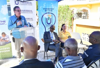 Minister of Science, Energy, Telecommunications and Transport and Member of Parliament for Portland Western, Hon. Daryl Vaz (left), brings remarks at the launch of community Wi-Fi in Cornwall Barracks, Portland, on February 7. Also pictured are (from second left) Chief Executive Officer of the Universal Service Fund (USF), Dr. Daniel Dawes, and Member of Parliament for Portland Eastern, Ann-Marie Vaz. The free and safe community Wi-Fi was installed by the USF as part of a national drive.
