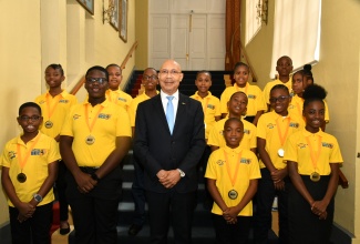 Governor-General, His Excellency the Most Hon. Sir Patrick Allen (centre), shares a photo opportunity with the 2024 finalists in The Gleaner's Children’s Own Spelling Bee, during a courtesy call at King’s House on Thursday (February 8).