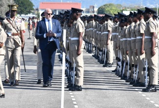 President of the Private Sector Organization of Jamaica, Keith Duncan, inspects recruits trained under the Jamaica National Service Corps (JNSC), at the passing out parade held at the Polo Grounds, Up Park Camp in Kingston on Friday (February 23).