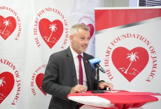 German Ambassador to Jamaica, His Excellency Jan Hendrik van Thiel, addresses a recent ceremony for the official handover of a fire alarm system at the offices of the Heart Foundation of Jamaica (HFJ) in Kingston.

