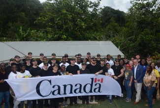 Representatives from Ministry of Education and Youth’s Early Childhood Commission (ECC), Sandals Foundation, and the Canadian High Commission in Jamaica, along with the crew aboard Canada’s HMCS ‘Margaret Brooke’, join the staff of Clapham Community Basic School in St. Ann, after completing the institution’s recent facelift.

