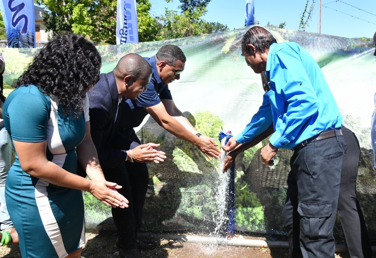 Prime Minister, the Most Hon. Andrew Holness (third left), officially commissions the Middle Quarters Greater Water Supply Project in Lancewood, St. Elizabeth, on Wednesday (February 21). Also participating are (from left) Councillor for the Brompton Division, Whitney Smith-Currie; Minister of Agriculture, Fisheries and Mining and Member of Parliament for St. Elizabeth South West, Hon. Floyd Green;  and Mayor of Black River, Councillor Derrick Sangster.  