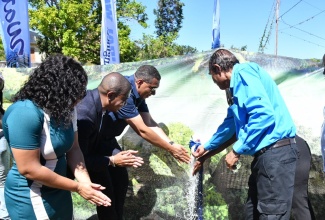 Prime Minister, the Most Hon. Andrew Holness (third left), officially commissions the Middle Quarters Greater Water Supply Project in Lancewood, St. Elizabeth, on Wednesday (February 21). Also participating are (from left) Councillor for the Brompton Division, Whitney Smith-Currie; Minister of Agriculture, Fisheries and Mining and Member of Parliament for St. Elizabeth South West, Hon. Floyd Green;  and Mayor of Black River, Councillor Derrick Sangster.