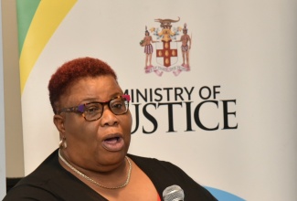 Executive Director, Children First, Claudette Pious, addresses a Social Justice (SO-JUST) project event at The Jamaica Pegasus hotel in New Kingston recently.

