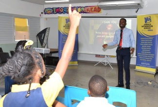 Jamaica Information Service (JIS) Web Master, Sean Hunter (right), engages students of Christel House Jamaica about careers in the field of technology during a visit to the institution in St. Catherine on February 8. Christel House is staging Career Week from February 5-9 under the theme ‘Dare to Dream STEAM – Science, Technology, Engineering, Arts and Mathematics’. During the week, students get an opportunity to engage with professionals from the STEAM fields and learn about the possible career paths they can take.

