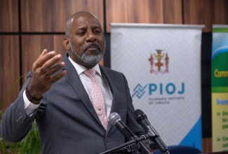 Director General, Planning Institute of Jamaica (PIOJ), Dr. Wayne Henry, speaks during a Memorandum of Understanding (MoU) signing ceremony between the PIOJ and the HEART/NSTA Trust. The signing took place the PIOJ’s Oxford Road offices in St. Andrew on Friday (February 23).