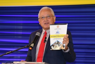 Minister of Justice, Hon. Delroy Chuck, delivers remarks during the 15th staging of the Restorative Justice Conference held on Wednesday (February 7) at The Summit in Kingston.  

 