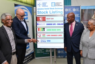 Minister of Industry, Investment and Commerce, Senator the Hon. Aubyn Hill (second right), participates in the ceremony for the listing of Project STAR (Social Transformation and Renewal) on the Jamaica Social Stock Exchange (JSSE), at the offices of the Jamaica Stock Exchange in downtown Kingston on February 6. Also taking part (from left) are Chairman, JSSE, Professor Neville Ying; Co-Chair, Project STAR, Keith Duncan; and Managing Director, Jamaica Stock Exchange, Dr. Marlene Street Forrest.

