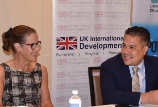 Minister without Portfolio in the Ministry of Economic Growth and Job Creation, Senator the Hon. Matthew Samuda, in discussion with British High Commissioner to Jamaica, Her Excellency Judith Slater, at the launch of the ‘Regional Climate Finance Programme: Small Island Developing States Capacity and Resilience (SIDAR) Programme for the Caribbean’, today (February 20), at the ROK Hotel in downtown Kingston.