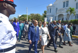 Prime Minister, the Most Hon. Andrew Holness (third right), marches down Duke Street in downtown Kingston on Thursday (February 15) flanked by fellow parliamentarians, ahead of the Ceremonial Opening of Parliament for 2024/25.  Others (from left, front) are Deputy Prime Minister and Minister of National Security, Hon. Dr. Horace Chang; Foreign Affairs and Foreign Trade Minister, Senator the Hon. Kamina Johnson Smith; Minister of Tourism, Hon. Edmund Bartlett; Minister of Culture, Gender, Entertainment and Sport, Hon. Olivia Grange, and Minister of Local Government and Community Development, Hon. Desmond McKenzie.

